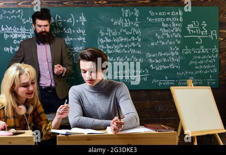International student making individual online testing and writing composition for annual exams. People learning education and school concept - Stock Photo