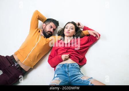 Man and woman wear modern clothes for youth generation. Forever young. Couple hang out together. Youth just want to have fun. Freedom feeling. Youth Stock Photo