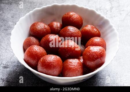 Top view of group of tasty gulab jamuns, Indian sweets in a bowl Stock Photo