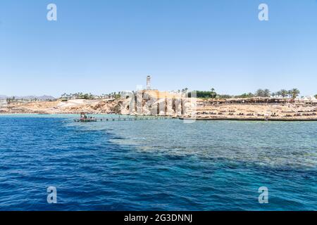 Beautiful rocky coast in the resort town of Sharm el Sheikh, Egypt. View from the sea. Egyptian landscape in Sinai. Stock Photo