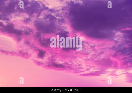 Photo dramatic colored evening sky with pink blue clouds. Useful as background or to replace the sky. Stock Photo