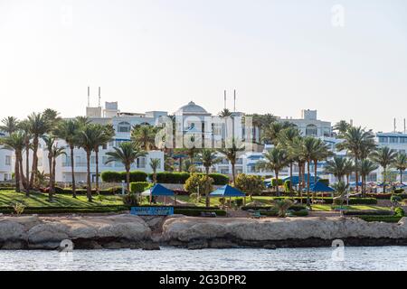 Beautiful rocky coast in the resort town of Sharm el Sheikh, Egypt. View from the sea. Egyptian landscape in Sinai. Stock Photo