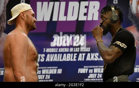 (R) Deontay 'The Bronze Bomber' Wilder takes off his shades to face off with with Tyson Fury at a press conference Tuesday, Los Angeles, CA.USA. June 15,2021The two will fight for a 3rd time on Saturday, July 24, headlining a pay-per-view event live from T-Mobile Arena in Las Vegas NV  (Photo by Gene Blevins) Stock Photo