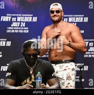 (R)Tyson 'The Gypsy King' Fury taunts Deontay Wilder at the start of a Los Angeles press conference on their up coming 3rd fight Tuesday, Los Angeles CA.USA. June 15,2021The two will fight on Saturday, July 24, headlining a pay-per-view event live from T-Mobile Arena in Las Vegas NV (Photo by Gene Blevins) Stock Photo