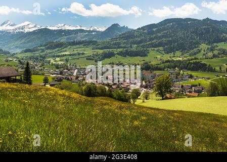 The village of Neu St. Johann in Toggenburg, in the background the Churfirsten, Canton St. Gallen, Switzerland Stock Photo