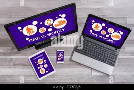 Time is money concept shown on different information technology devices Stock Photo