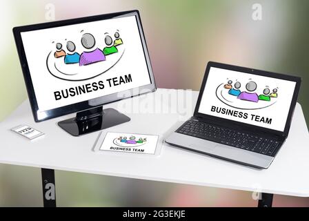 Business team concept shown on different information technology devices Stock Photo