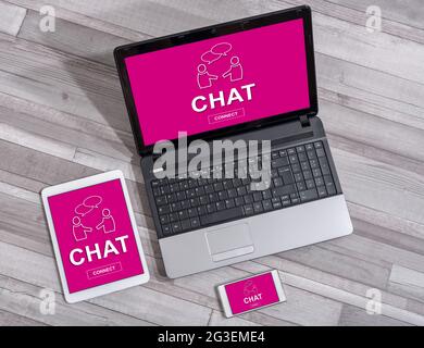 Chat concept shown on different information technology devices Stock Photo
