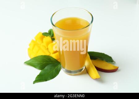 Mango juice and fruit on white background Stock Photo