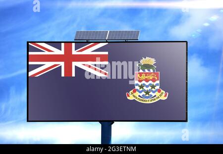 Billboard with Cayman islands flag and solar battery on blue sky background Stock Photo