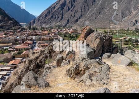 Scenic view looking over pre-Inca ruins to the town of Ollantaytambo, Sacred Valley, Peru Stock Photo