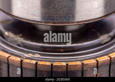 Copper commutator bar of the electric motor close up. Electric motor rotor. Stock Photo