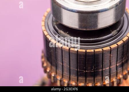 Copper commutator bar of the electric motor close up. Electric motor rotor. Stock Photo