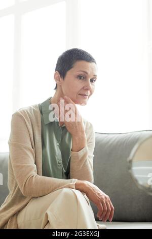 Hands of senior Woman setting up the fitness smart watch and headphones