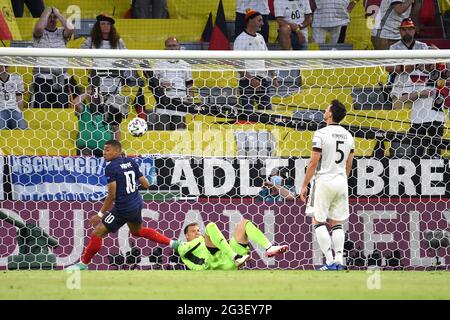 Muenchen/Germany, June 15, 2021, Munich, Germany. 15th June, 2021. goal to 1-0 through an own goal by Mats HUMMELS r. (GER), left to right Kylian MBAPPE (FRA), goalwart Manuel NEUER (GER), Mats HUMMELS (GER), group stage, preliminary round group F, game M12, France (FRA) - Germany (GER), on June 15, 2021 in Munich, Germany. Football EM 2020 from 06/11/2021 to 07/11/2021. Â Credit: dpa/Alamy Live News Stock Photo