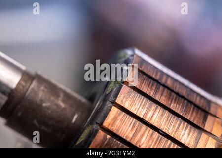 Copper commutator bar of the electric motor close up. Electric motor rotor. Stock Photo