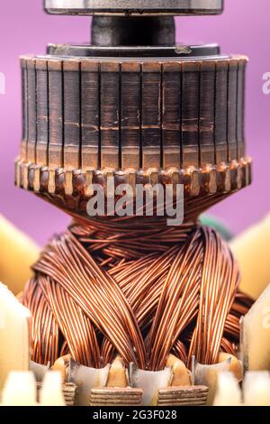 Copper commutator bar of the electric motor close up. Electric motor rotor. Stock Photo