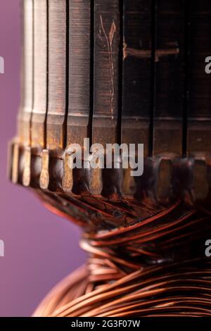 Copper commutator bar of the electric motor close up. Electric motor rotor. Stock Photo