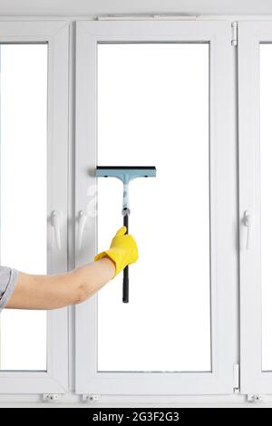 Cleaning  modern PVC windows with a hand-held squeegee concept isolated on white Stock Photo