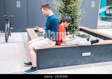 Use of modern technologies in everyday life of young family. High quality photo. Modern lifestyle Stock Photo