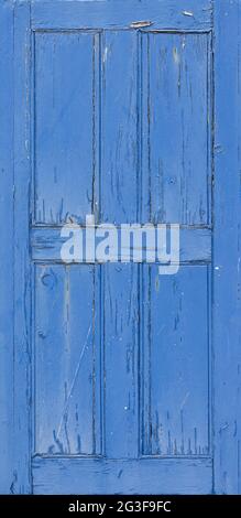 Close up of an old weathered window shutter with flaking paint. Background wallpaper Stock Photo