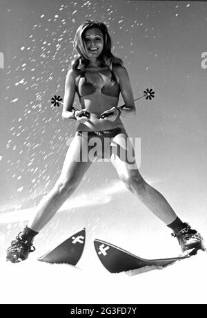 sports, winter sports, skiing, young woman in bikini, 1960s, ADDITIONAL-RIGHTS-CLEARANCE-INFO-NOT-AVAILABLE Stock Photo