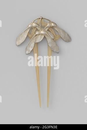 Hair Comb With Maple Seed Pods. Hair comb of Hoorn and Silver in Art Nouveau style. Decorated with silver plated maple seeds. Stock Photo