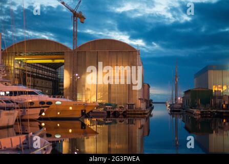 Sunset in Viareggio, Italy. Beautiful promenade with channel and boats Stock Photo