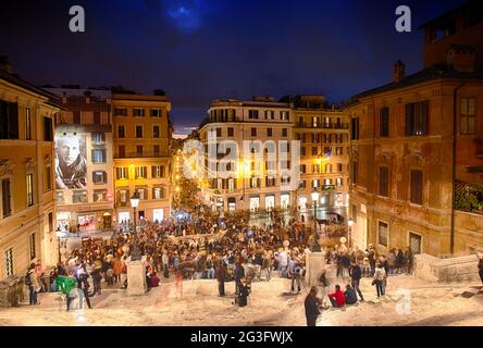 ROME - NOV 3: People climb the spanish steps of Piazza di Spagna on the evening of November 3, 2012 in Rome. The 'scalinata' is Stock Photo