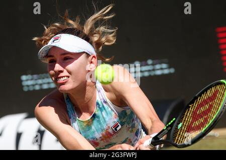 Ekaterina Alexandrova of Russia plays a backhand return to Emma ...