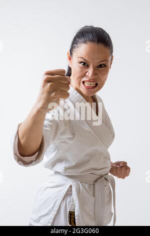 Funny woman in kimono on white Stock Photo