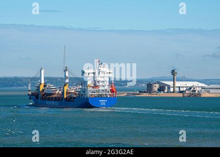 Southampton Water, England, UK. 2021. Henrix S a general cargo ship underway with a cargo of leisure boats on Southampton Water passing Calshot Spit. Stock Photo