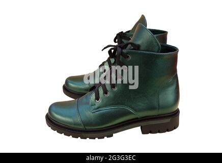 Green leather shoes isolated on white background. Winter and spring off-season boots. Stylish boot. Close-up. Laces, tractor sole. Casual style Stock Photo