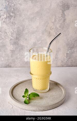 Lassi is traditional Indian cold refreshing drink with mango, mint and ice. Perfectly quenches thirst in hot weather. Copy space Stock Photo