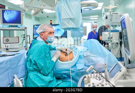 surgeon performs kidney surgery Stock Photo