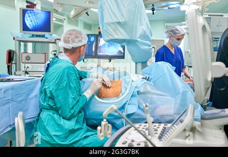 surgeon performs kidney surgery Stock Photo