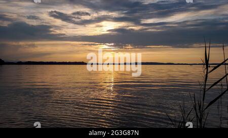Moody Sunset over Chiemsee, Bavaria, Germany Stock Photo