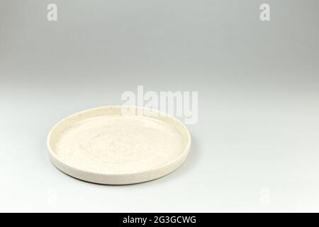 Empty White Ceramic Plate with High Borders on gray background Stock Photo