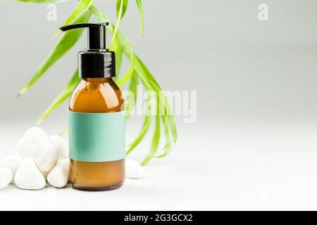 Face cleansing oil or gel, skin care product, makeup removal, facial cleanser with blank label Stock Photo