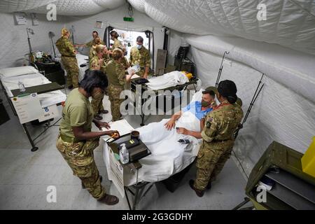 Medical staff from the military services during a test of the Army Medical Service's Mytchett based 22 Field Hospital, at Barton Stacey in Hampshire. The 22 Field Hospital is about to assume the mantle of the Army's High Readiness Hospital, meaning they can expect to be put on five days' notice to deploy - that could be to serve on an overseas operation, or to provide humanitarian relief in the case of a natural disaster anywhere around the world. Picture date: Wednesday June 16, 2021. Stock Photo