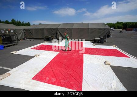Medical staff from the military services during a test of the Army Medical Service's Mytchett based 22 Field Hospital, at Barton Stacey in Hampshire. The 22 Field Hospital is about to assume the mantle of the Army's High Readiness Hospital, meaning they can expect to be put on five days' notice to deploy - that could be to serve on an overseas operation, or to provide humanitarian relief in the case of a natural disaster anywhere around the world. Picture date: Wednesday June 16, 2021. Stock Photo