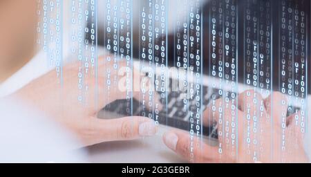 Binary coding data processing against mid section of person using laptop Stock Photo