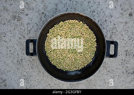 Bunch the yellow green soya beans in the pan on a concrete background Stock Photo