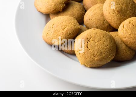 Gingerbread round cookies in a heap isolated on white background with copy space - gingersnap biscuits stack Stock Photo