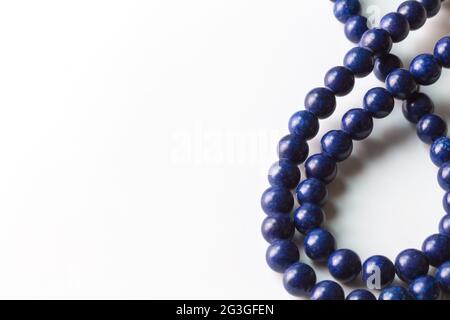 Lapis Lazuli bead necklace isolated on white with space for text - selective focus Stock Photo