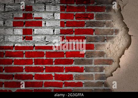 Dark brick wall with plaster - Tonga Stock Photo