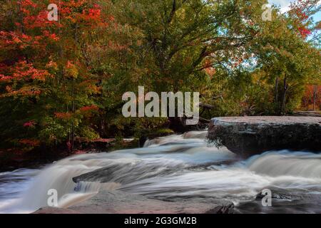 Shohola Falls along Shohola Creek in Pennsylvania's Pocono Mountains has numerous cascades before falling the final 50 feet into the main plunge pool. Stock Photo