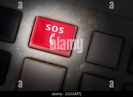 Red button on a dirty old panel Stock Photo
