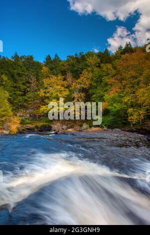 Shohola Falls along Shohola Creek in Pennsylvania's Pocono Mountains has numerous cascades before falling the final 50 feet into the main plunge pool. Stock Photo