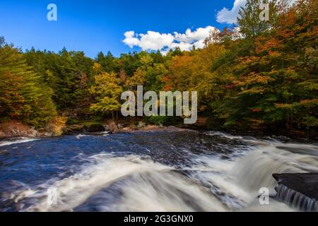 Shohola Falls along Shohola Creek in Pennsylvania's Pocono Mountains has numerous cascades before falling the final 50 feet into the main plunge pool. Stock Photo